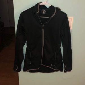 Black Oakley zip up sweatshirt.